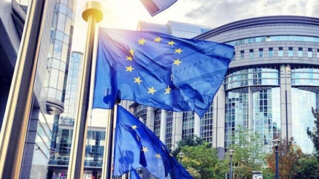 EU flags in front of the EU Parliament