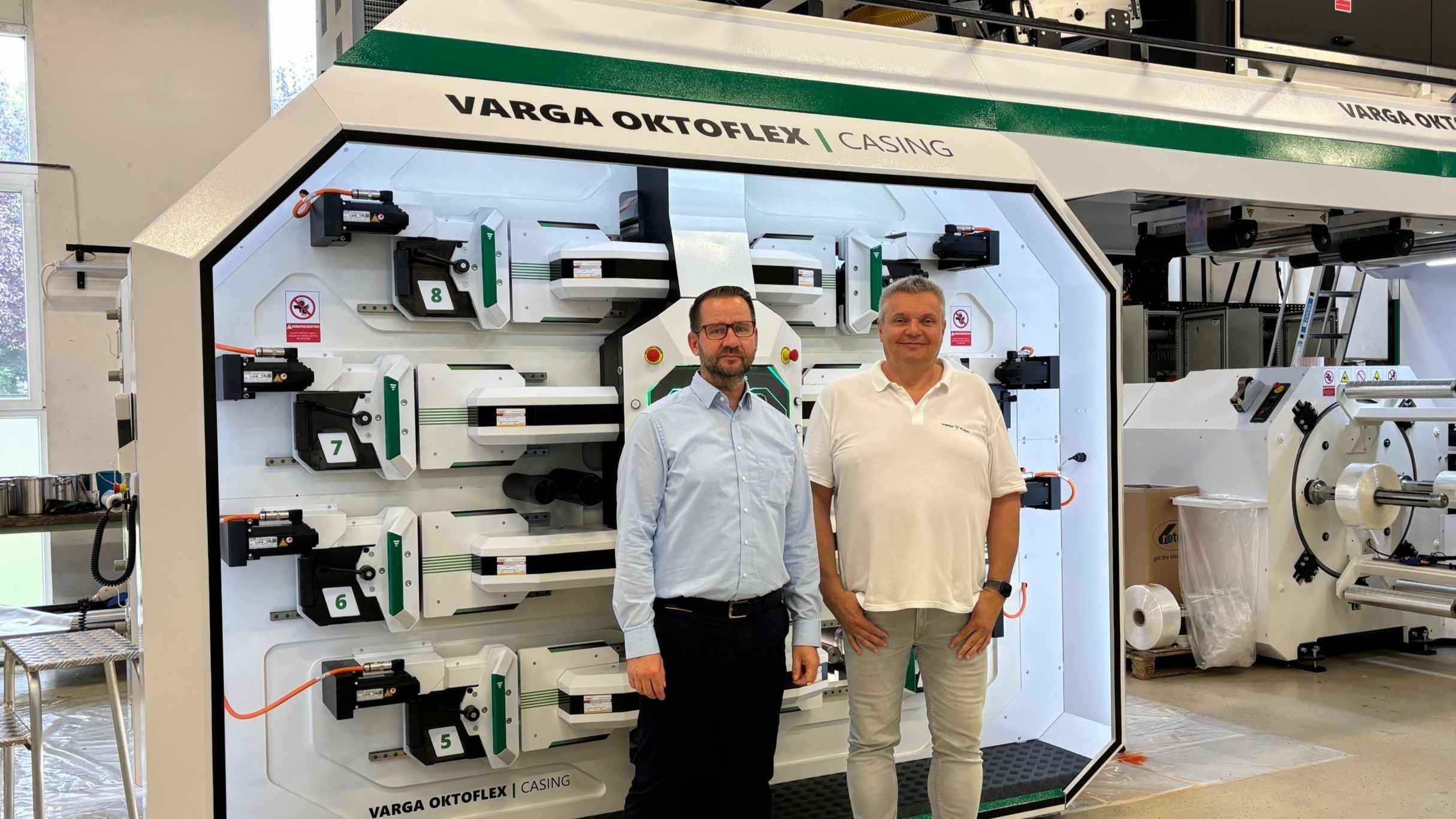 Zoltan Kelemen (left) and Dénes Varga, seen here with the company’s new Oktoflex Casing machine, are planning a long-term future with Vetaphone corona technology