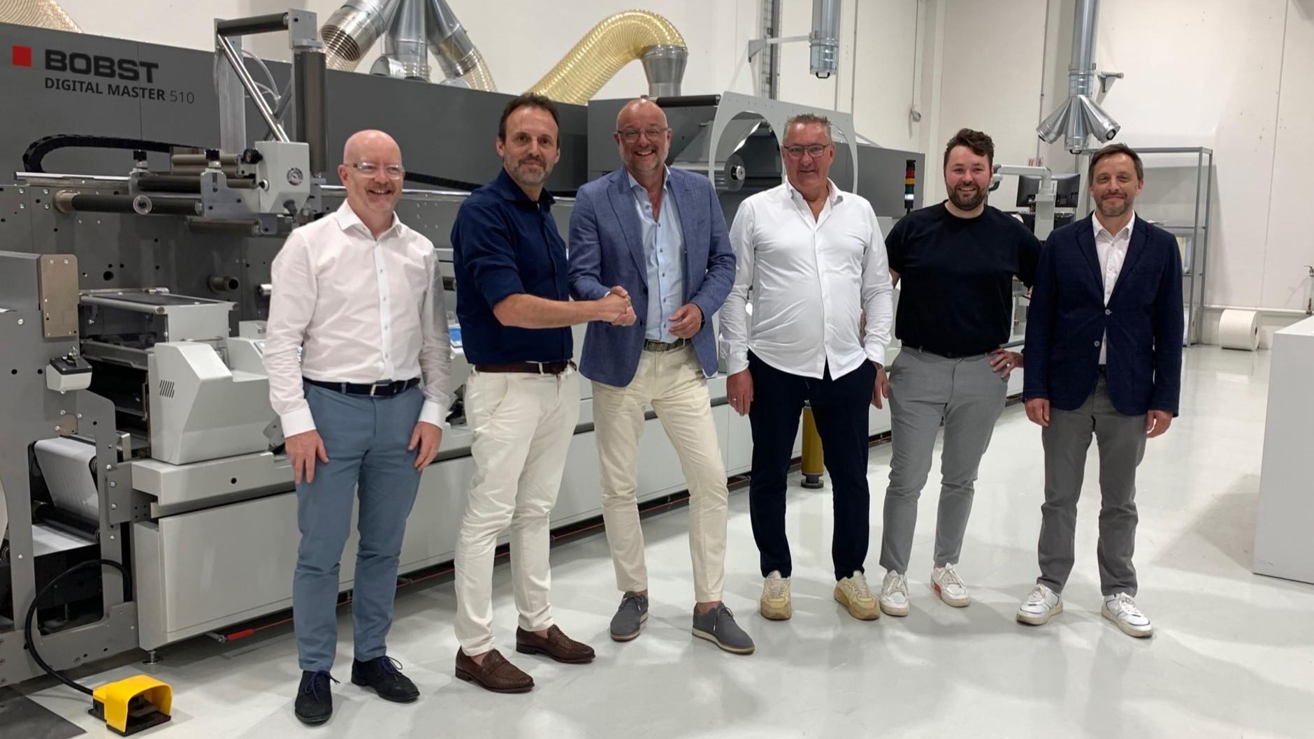 From left to right: N. Tracey BOBST NMW Technology Sales Director, M. Cardinotti NMW PL Head, Armand van Huut Geostick CEO, Cees Schouten COO from Geostick, Tommy Schouten Production Manager from Geostick, K. Vlieghe BOBST Zone Business Director.