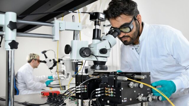 Two people doing research in the photonics lab