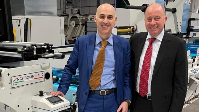Ivan Caldirola and Giuseppe Rossi with one of Minova Labels’ Lombardi Synchroline 430 presses