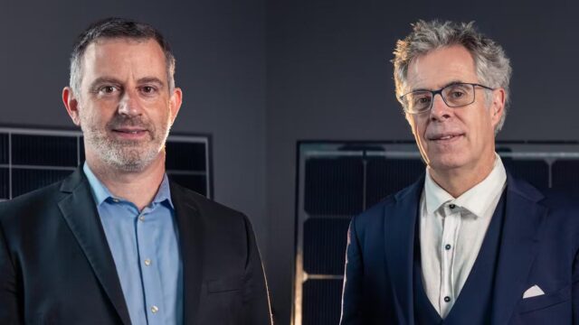 Tonio Buonassisi and Christophe Ballif in front of CSEM’s photovoltaic test panels in Neuchâtel